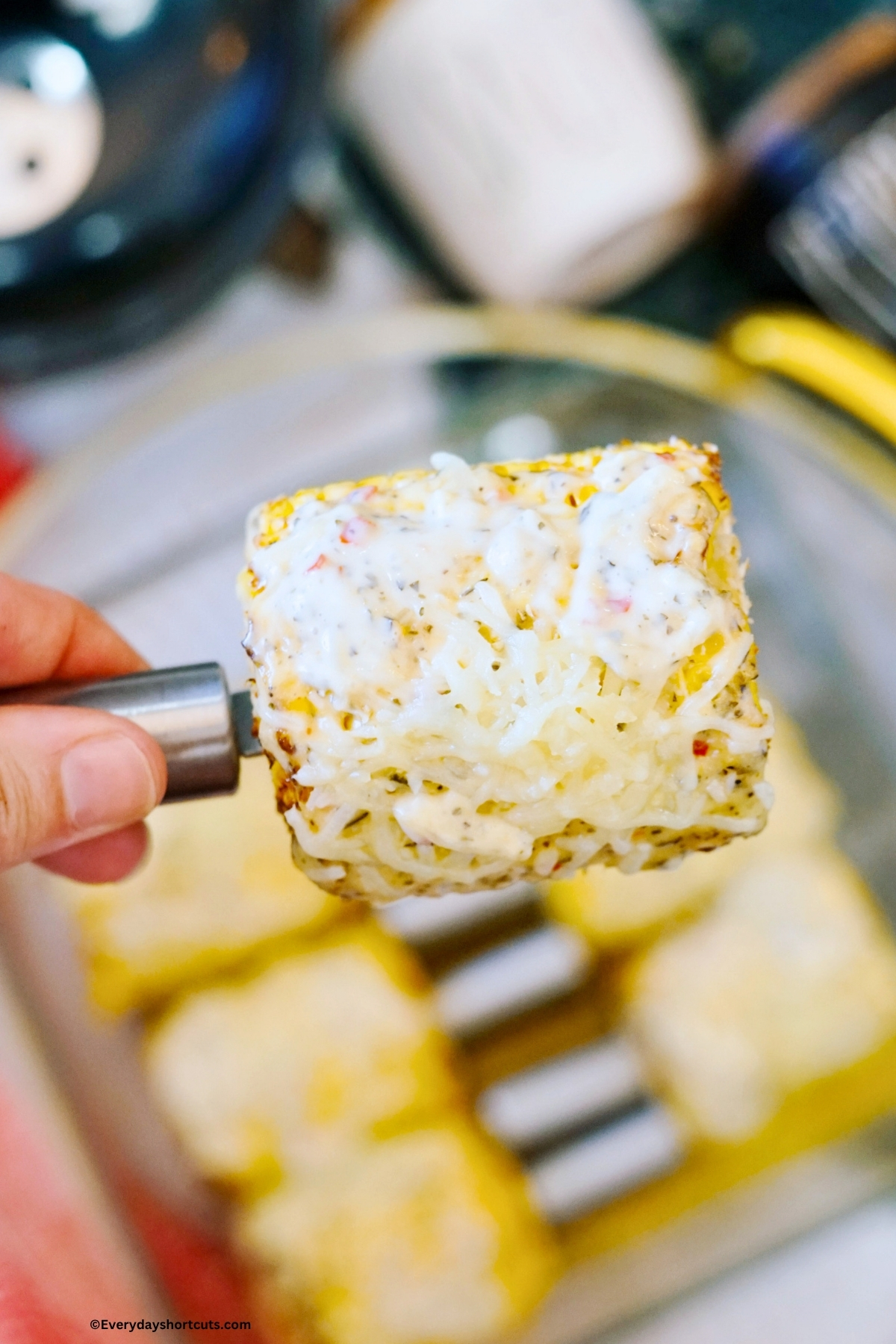 holding corn on the cob with a corn holder