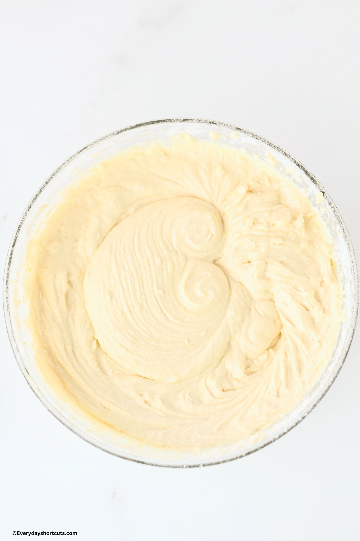 flour mixture, milk mixture and butter mixture combined in a bowl
