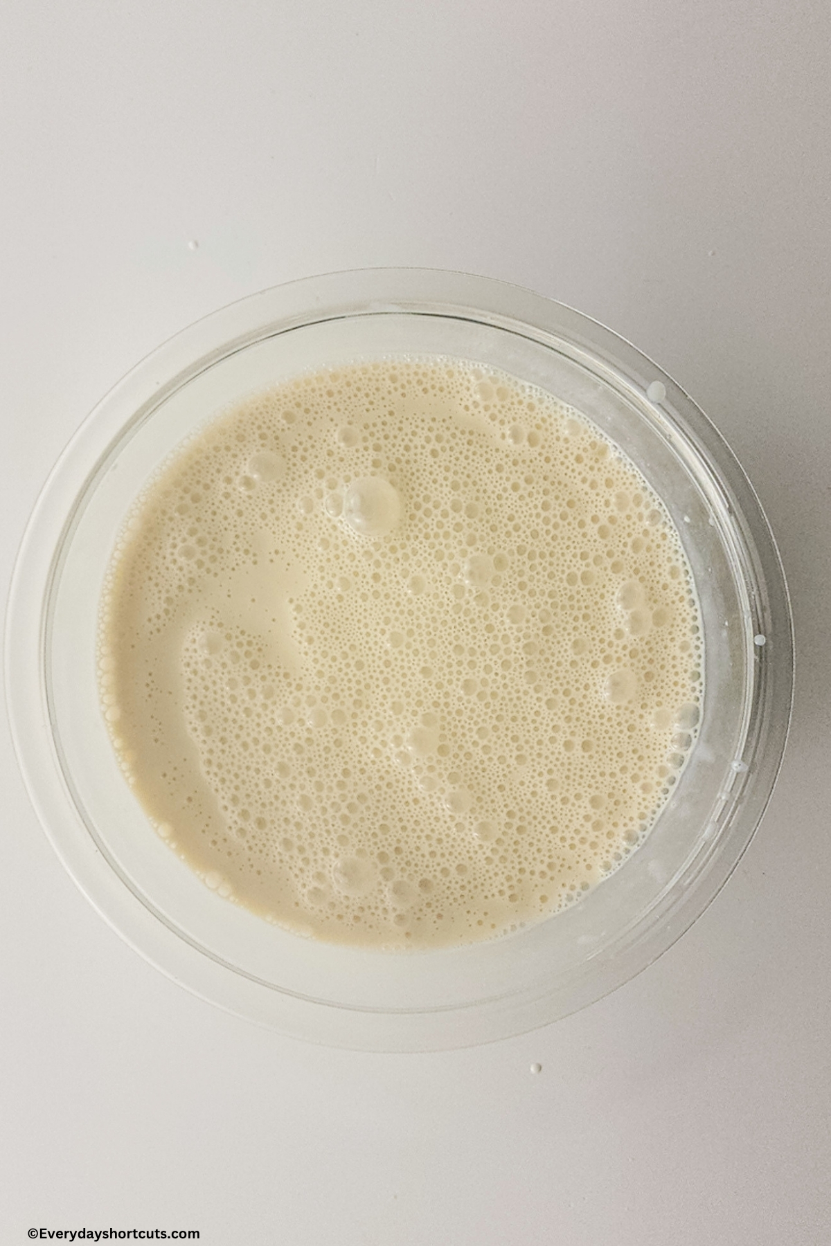 evaporated milk, sweetened condensed milk, milk and vanilla extract in a bowl