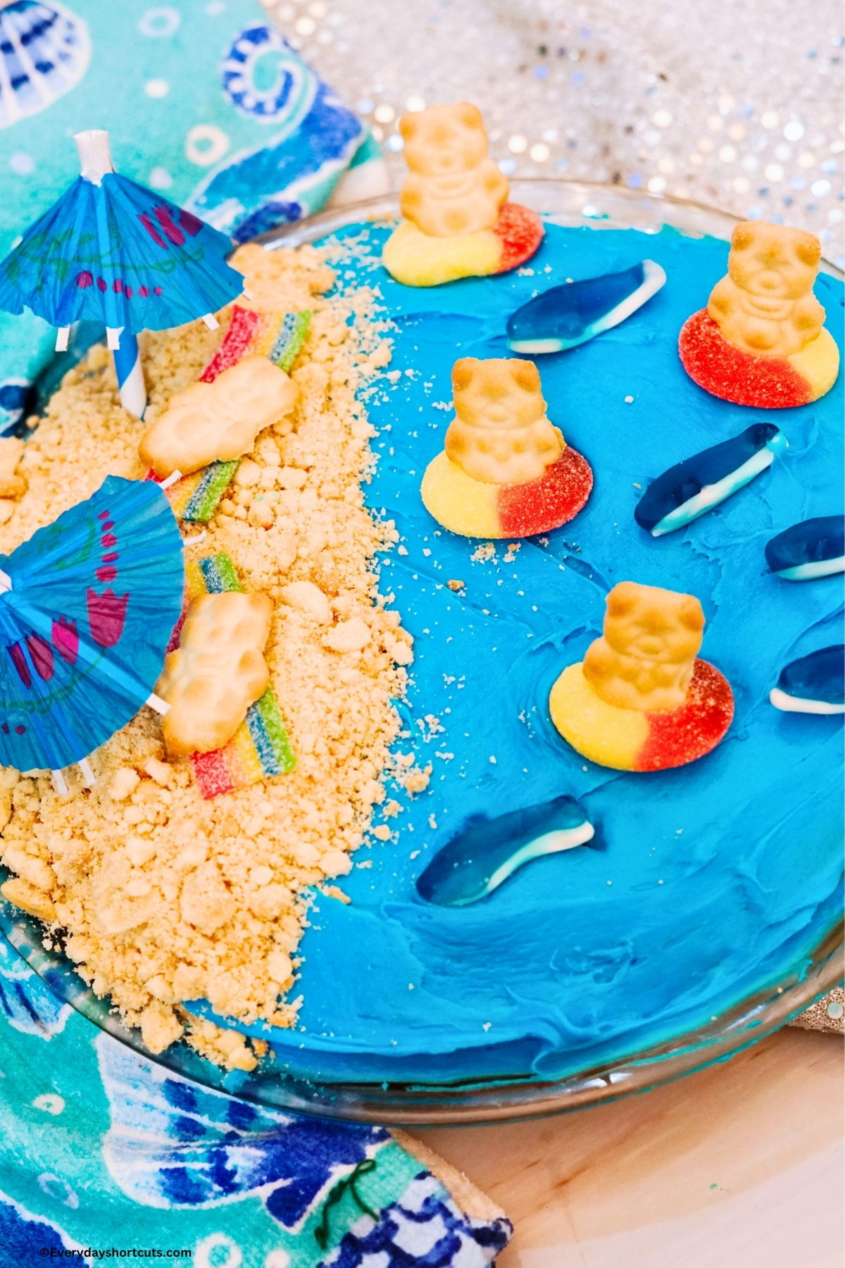 beach cake next to a seashell kitchen towel