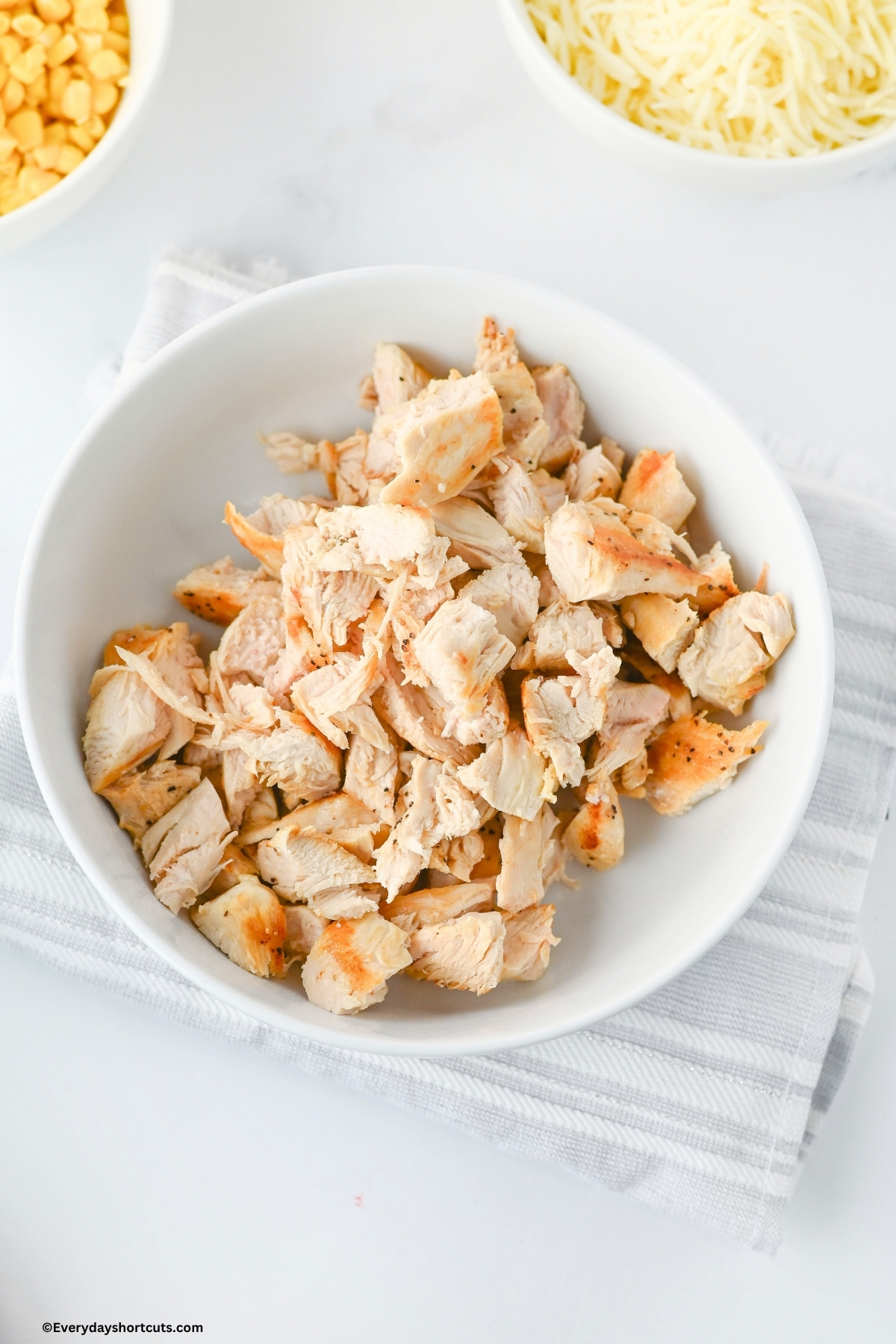 chopped chicken in a white bowl