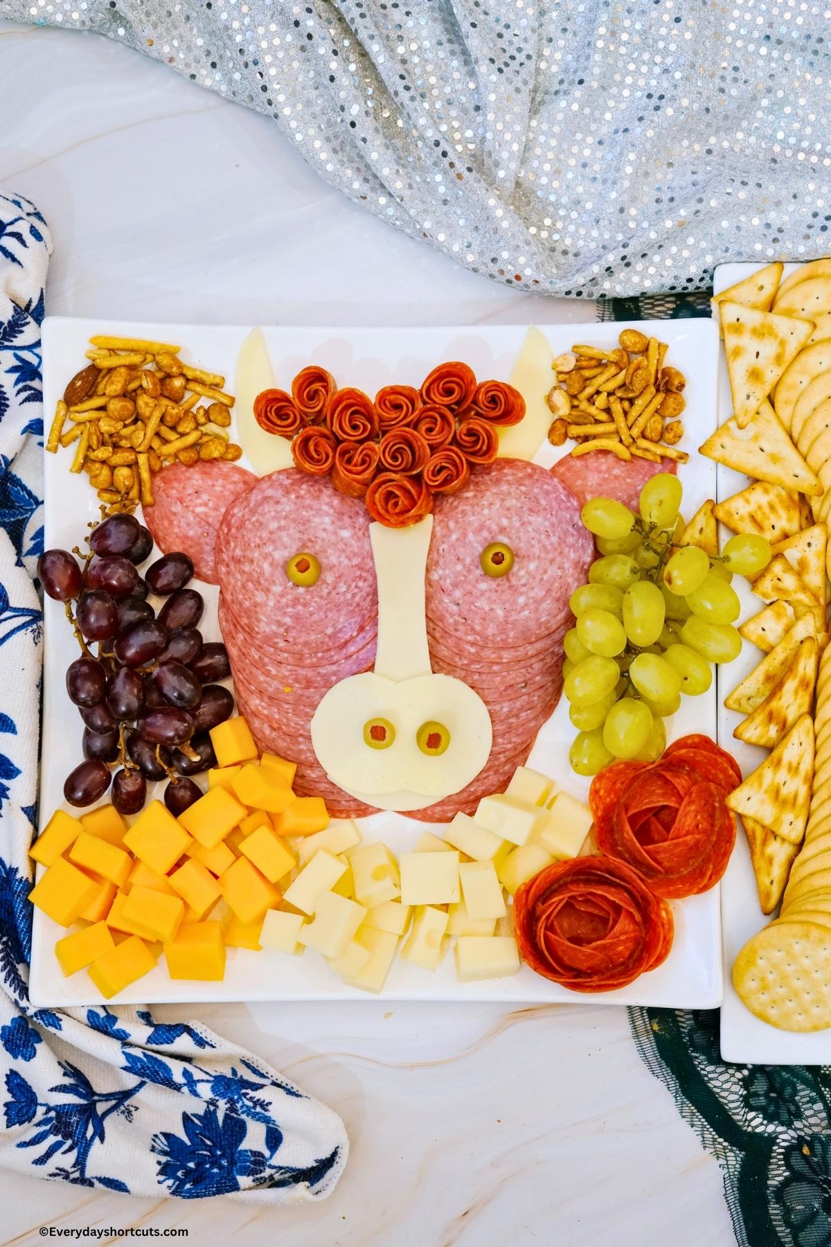charcuterie board shaped into a cow