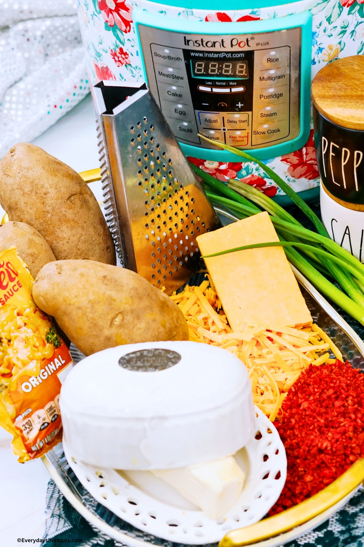 ingredients shown: Russet Potatoes, butter, Salt & Pepper, Shredded cheese, Velveeta cheese, bacon bits, green onions
