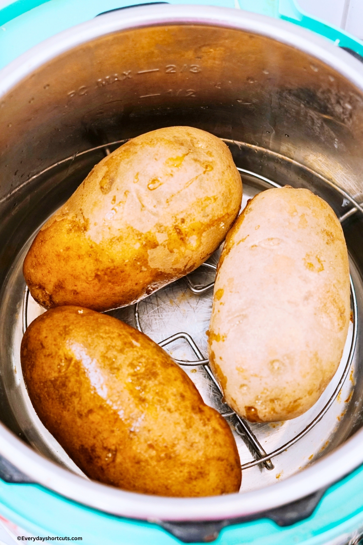Russet potatoes on a trivet in an Instant Pot