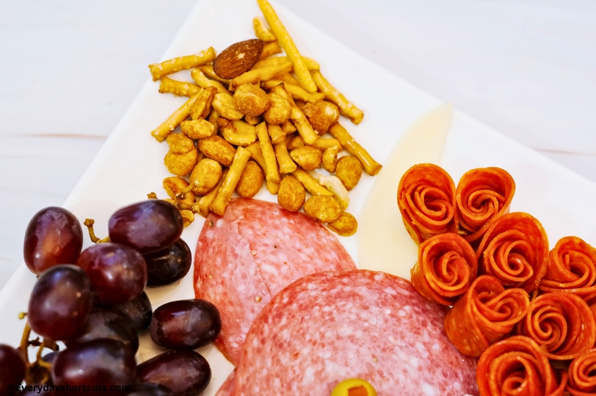 nuts and grapes on charcuterie board