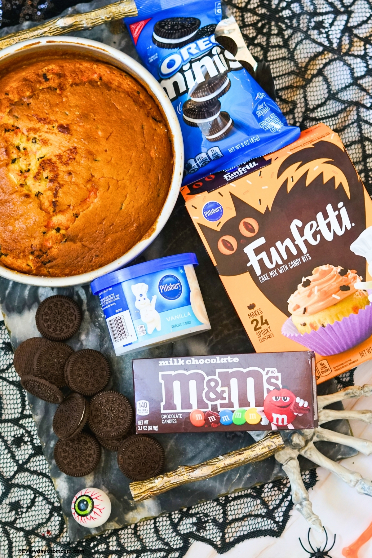 ingredients shown: funfetti box cake, Oreos, vanilla frosting, M&M's