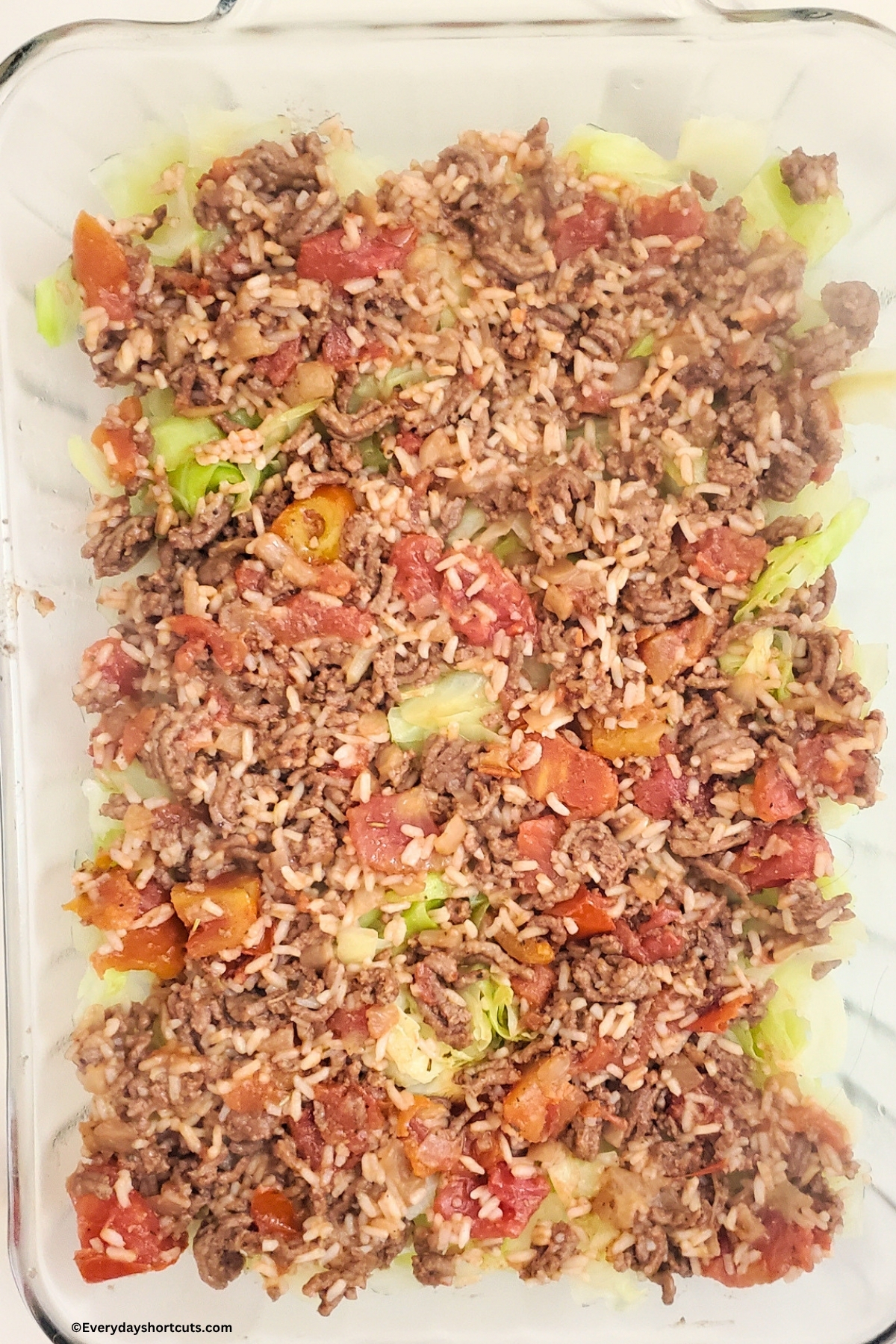 one layer of cabbage roll casserole in a baking dish