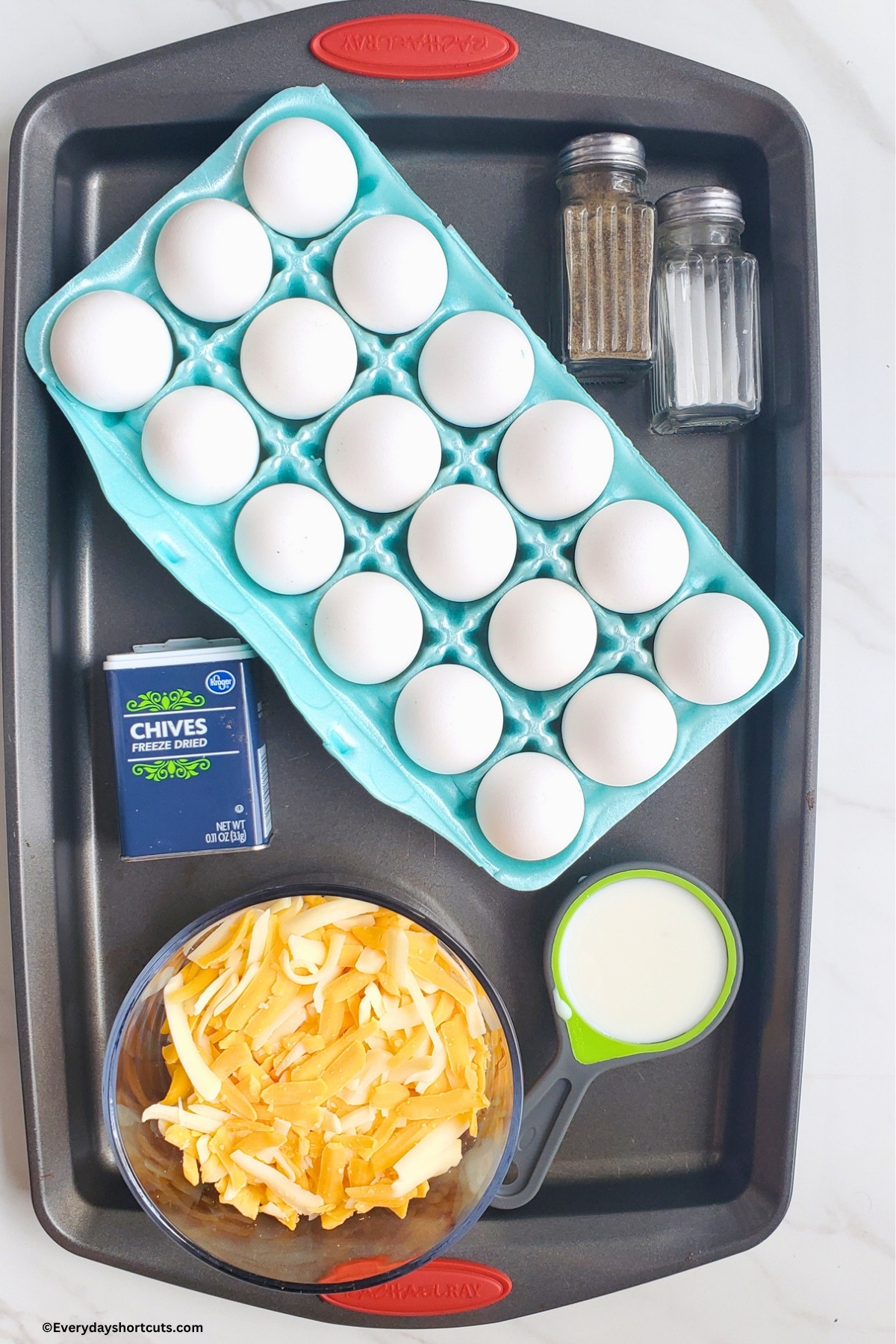 ingredients shown: 18 eggs, salt, pepper, chives, milk and shredded cheese