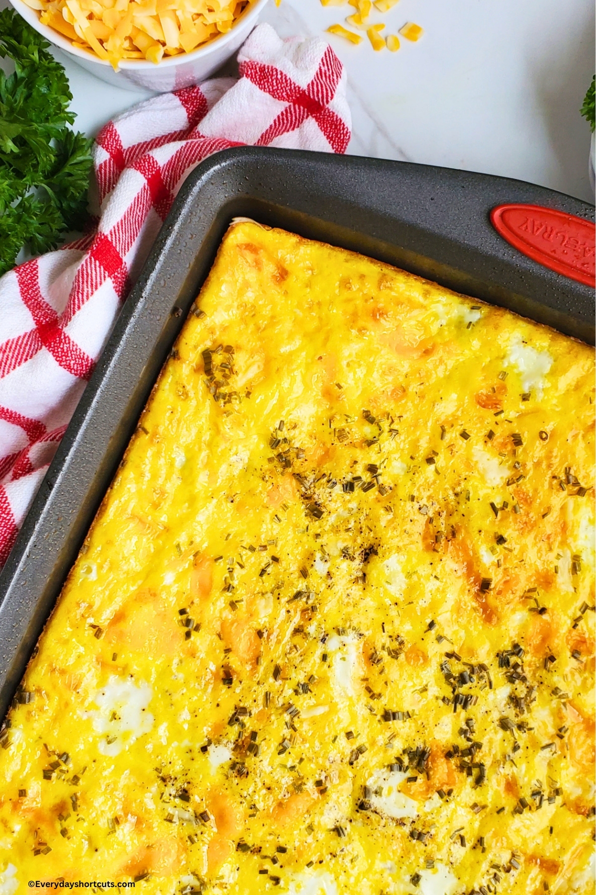 baked sheet pan eggs next to a red and white striped napkin