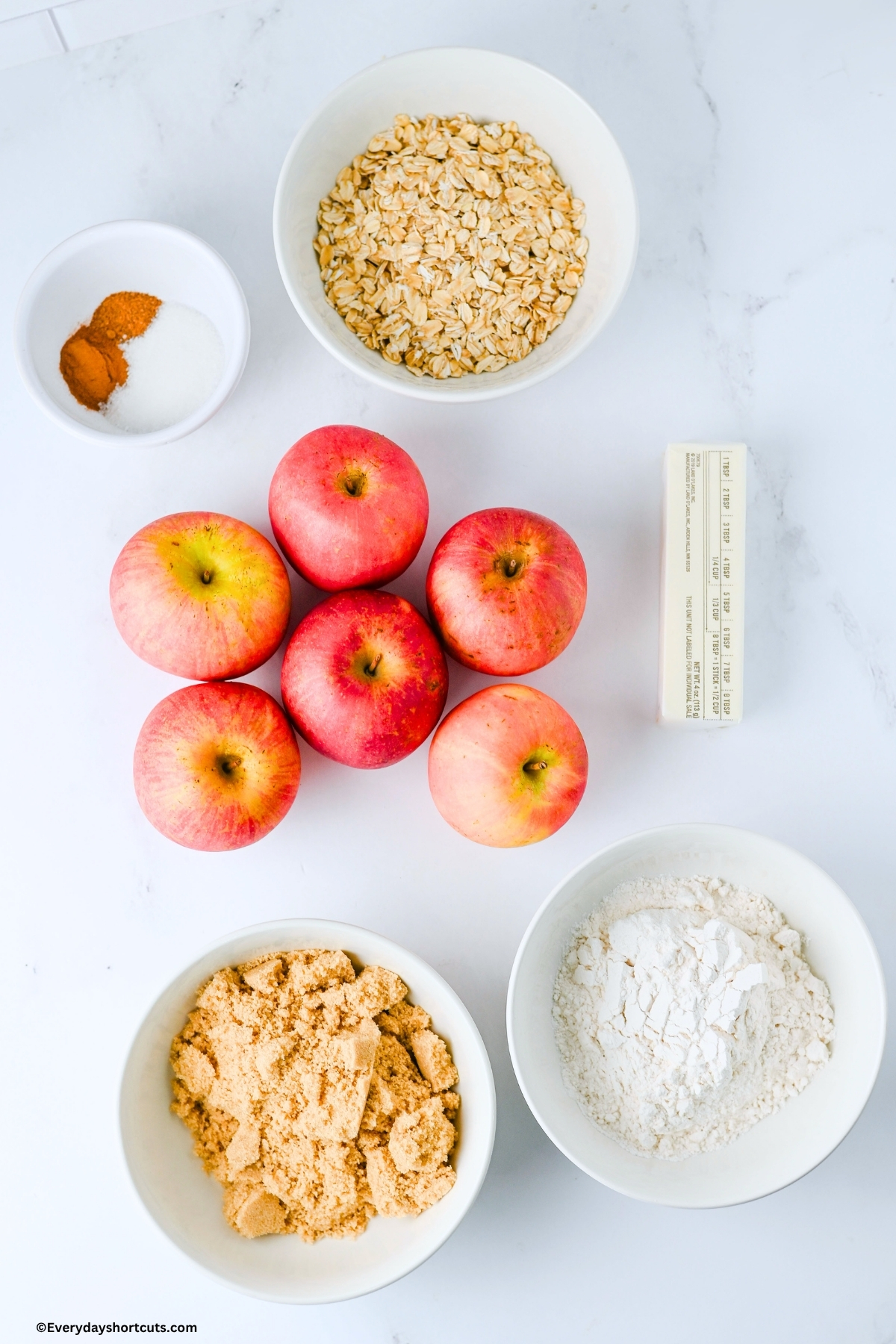 ingredients shown: butter, apples, oats, brown sugar, granulated sugar, flour, cinnamon, nutmeg