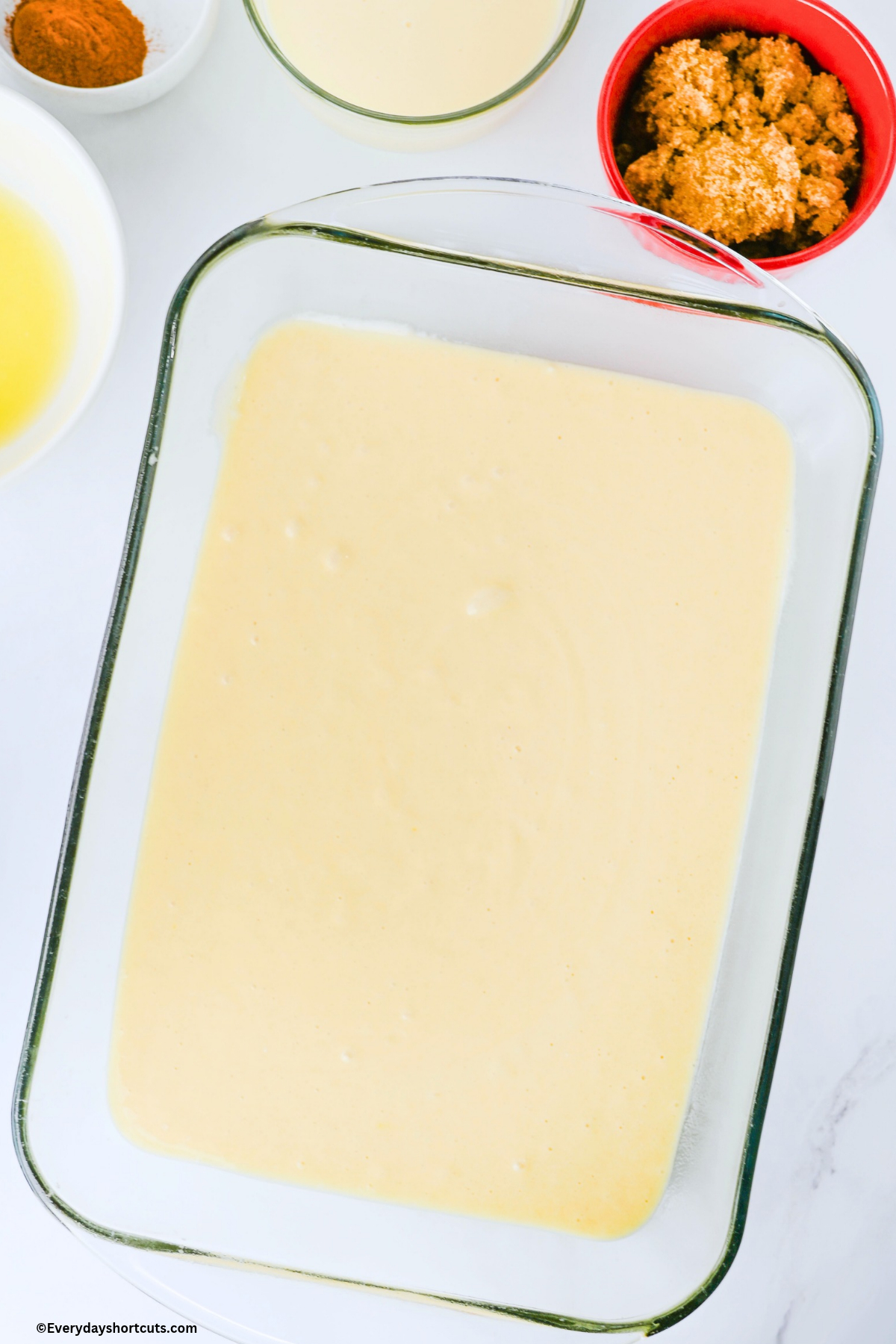 white cake batter mix in baking dish