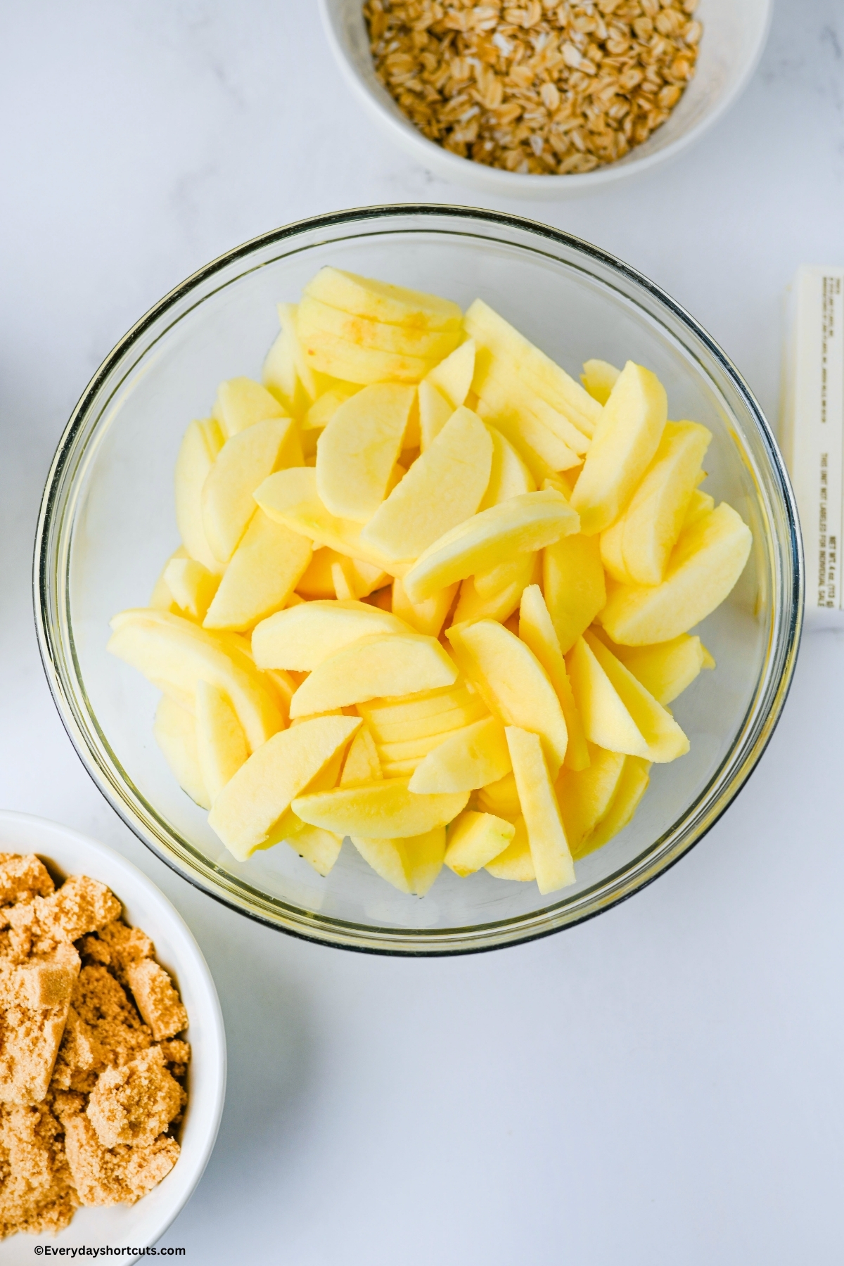 peeled and sliced apples in a bowl