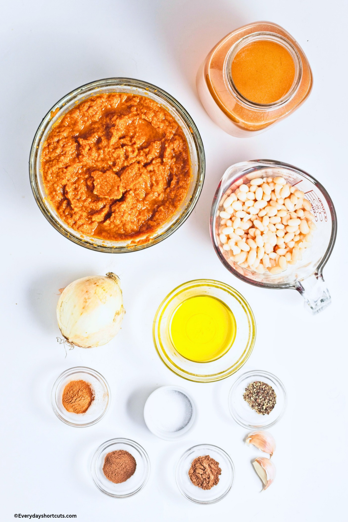 ingredients show: white beans, pumpkin puree, onion, cinnamon, salt, black pepper, garlic, nutmeg, vegetable broth