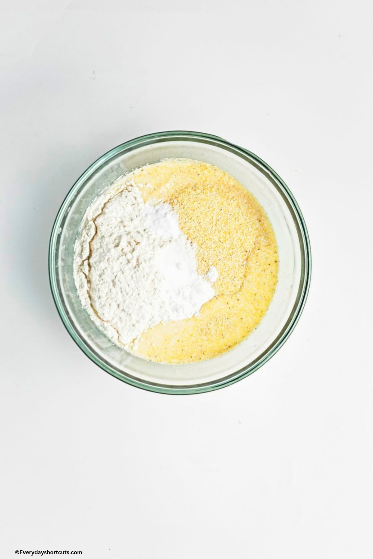 cornmeal, flour, baking powder, baking soda and salt in a bowl