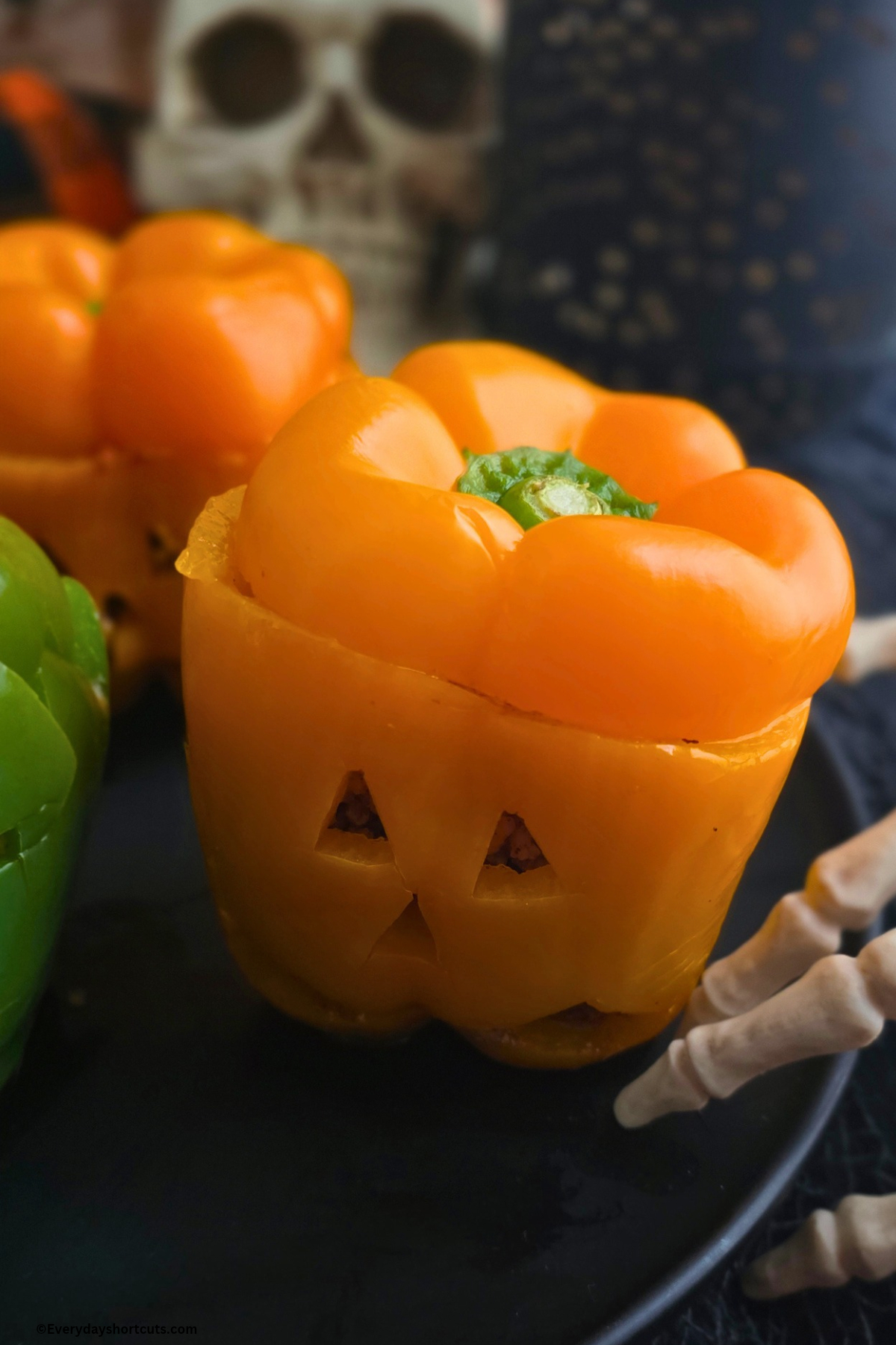 Orange bell pepper with a Jack O'Lantern face