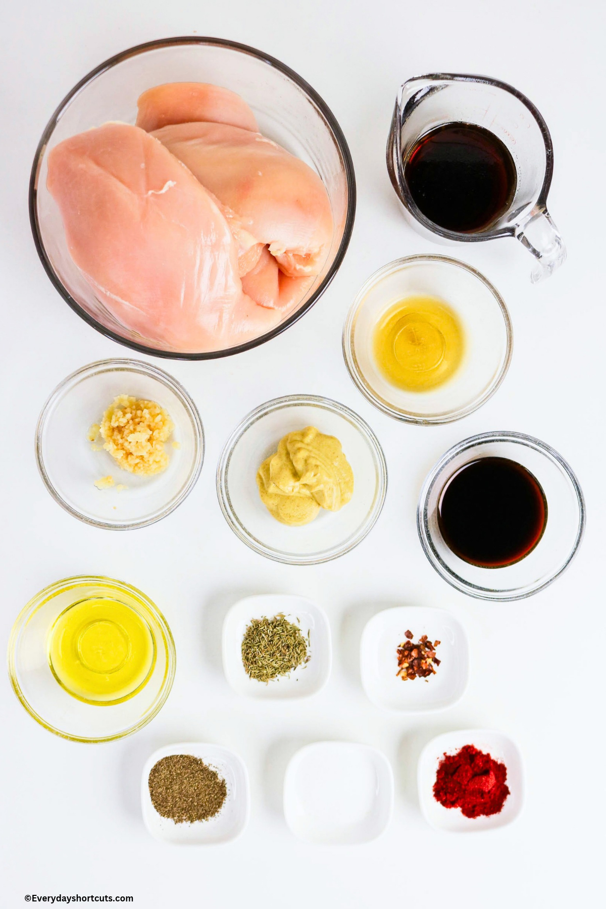 ingredients shown: chicken breasts, soy sauce, minced garlic, dijon mustard, olive oil, maple syrup, apple cider vinegar, salt pepper, smoked paprika, thyme, red pepper flakes