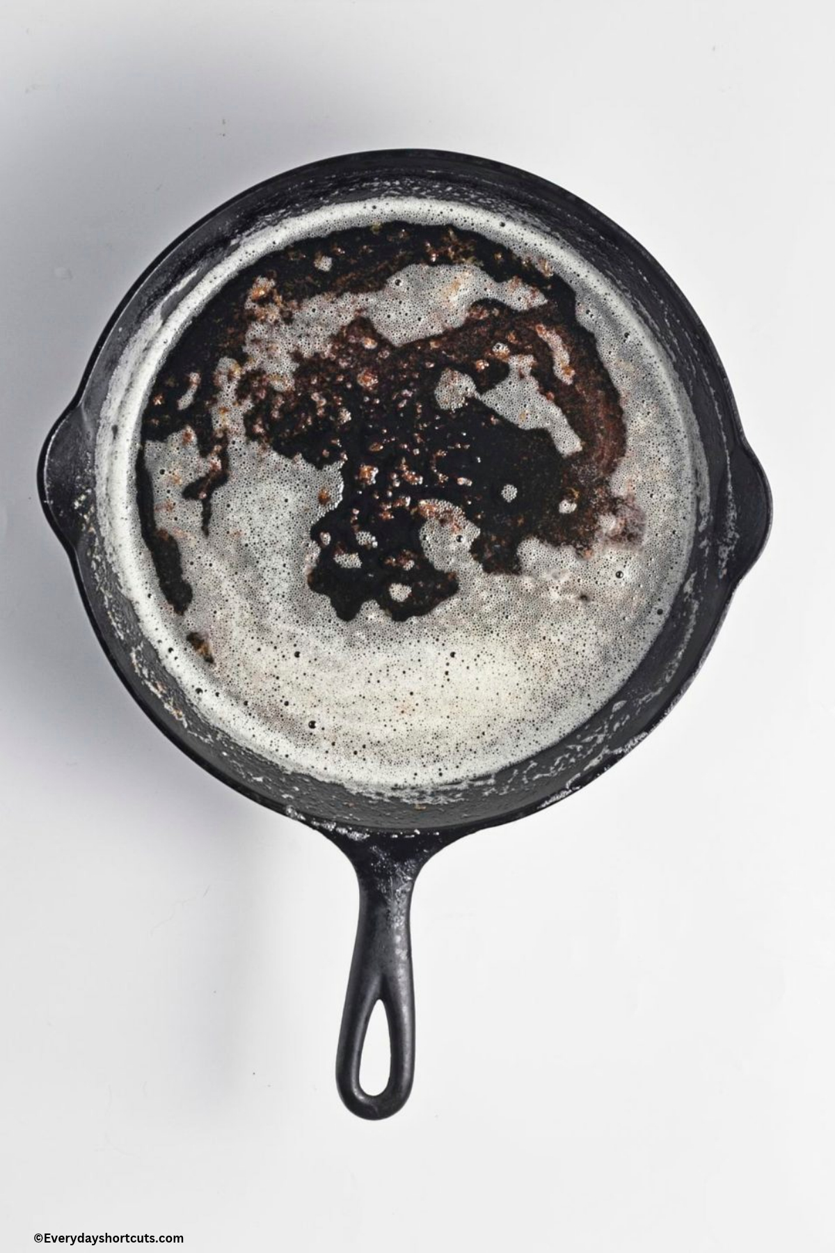melted butter foamed up in a cast iron skillet