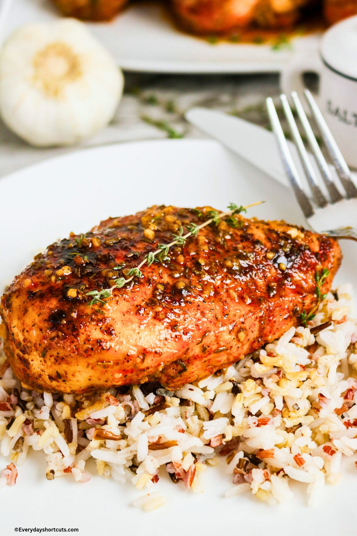 up close maple dijon chicken on a bed of rice